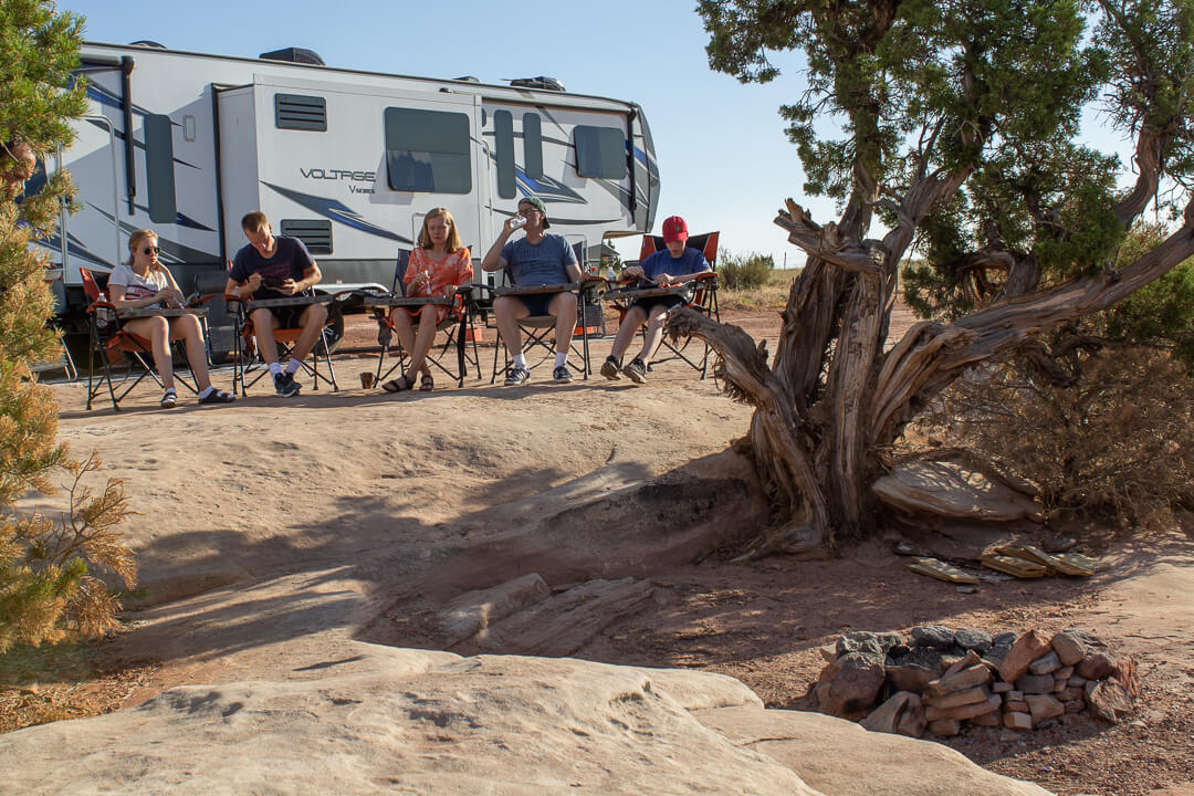 RV glamping tour family eating outdoor dining